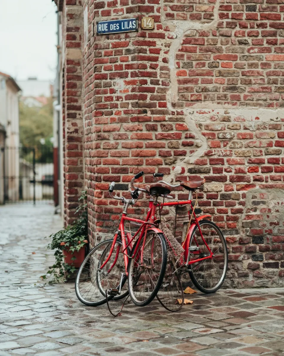 Red vintage bicycle against a brick wall made by Ideogram 4.5 free plan